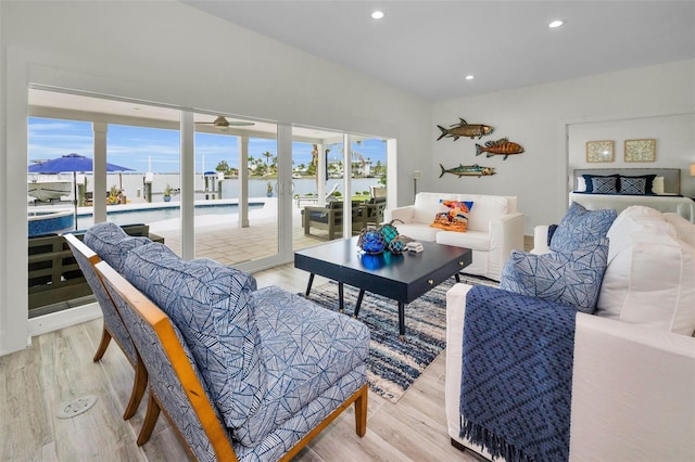 4381 Poinsettia Dr, St Pete Beach, FL 33706 - living area with plenty of natural light, light wood-type flooring, recessed lighting, and a water view