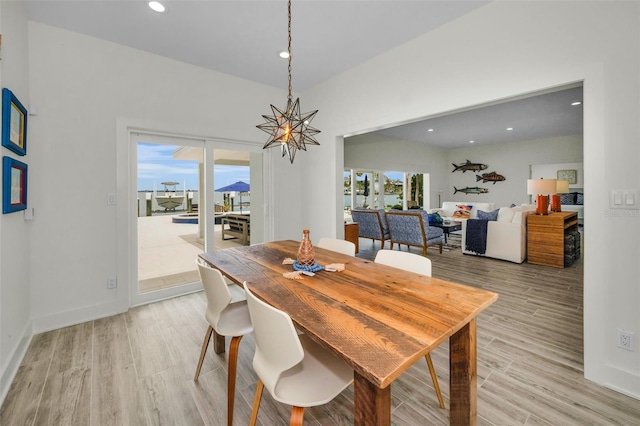 4381 Poinsettia Dr, St Pete Beach, FL 33706 - dining space featuring light wood-type flooring and recessed lighting