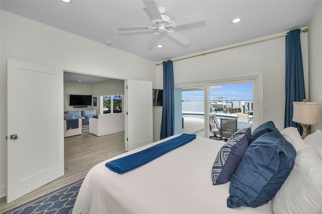 4381 Poinsettia Dr, St Pete Beach, FL 33706 - bedroom featuring multiple windows, access to outside, recessed lighting, wood finished floors, and a ceiling fan