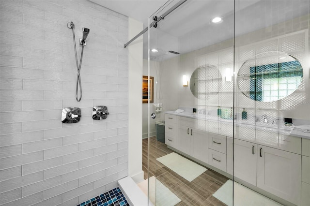 4381 Poinsettia Dr, St Pete Beach, FL 33706 - full bath with tiled shower, double vanity, and recessed lighting
