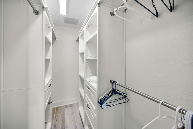 4381 Poinsettia Dr, St Pete Beach, FL 33706 - spacious closet featuring light wood-style floors