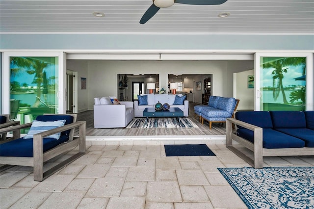 4381 Poinsettia Dr, St Pete Beach, FL 33706 - view of patio / terrace with an outdoor living space and a ceiling fan