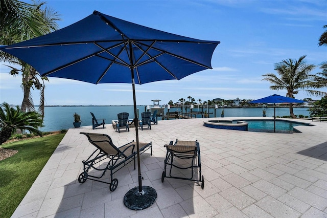 4381 Poinsettia Dr, St Pete Beach, FL 33706 - view of patio / terrace with a pool with connected hot tub and a water view