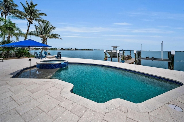 4381 Poinsettia Dr, St Pete Beach, FL 33706 - view of pool featuring boat lift, a boat dock, a patio area, a pool with connected hot tub, and a water view