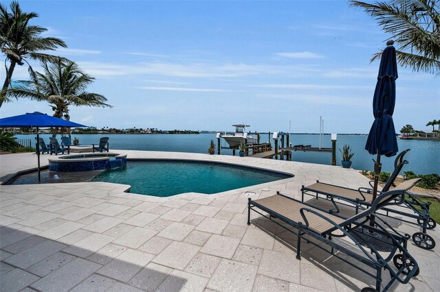 4381 Poinsettia Dr, St Pete Beach, FL 33706 - view of pool featuring boat lift, a patio area, a pool with connected hot tub, and a boat dock