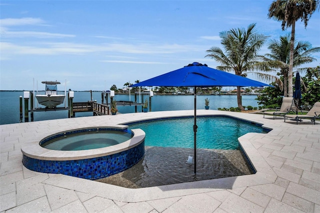 4381 Poinsettia Dr, St Pete Beach, FL 33706 - view of swimming pool featuring boat lift, a boat dock, a patio area, a pool with connected hot tub, and a water view