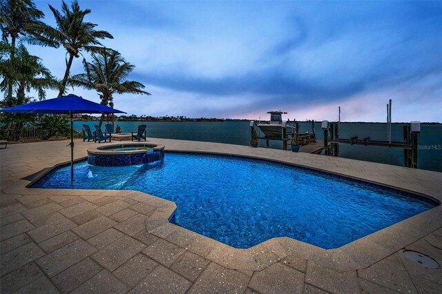 4381 Poinsettia Dr, St Pete Beach, FL 33706 - view of pool with boat lift, a patio area, a dock, and a pool with connected hot tub