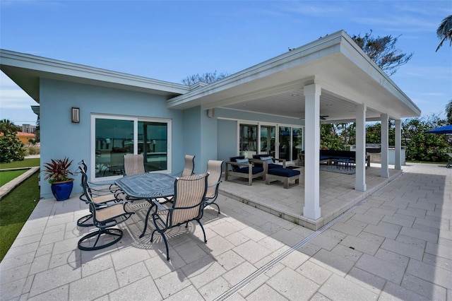 4381 Poinsettia Dr, St Pete Beach, FL 33706 - view of patio / terrace featuring an outdoor hangout area, outdoor dining area, and ceiling fan