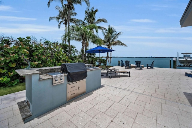 4381 Poinsettia Dr, St Pete Beach, FL 33706 - view of patio featuring area for grilling and a dock
