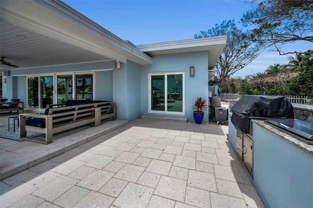 4381 Poinsettia Dr, St Pete Beach, FL 33706 - view of patio featuring an outdoor living space, exterior kitchen, and ceiling fan