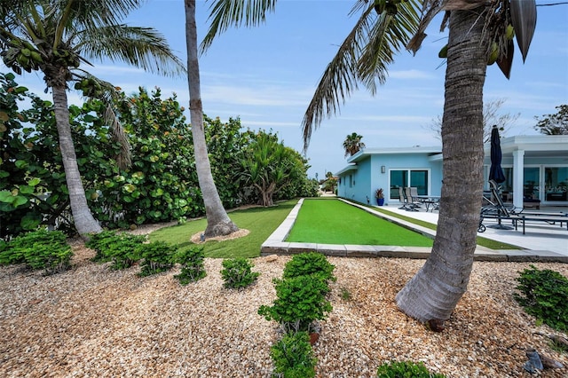 4381 Poinsettia Dr, St Pete Beach, FL 33706 - view of yard featuring a patio area and a bocce ball area