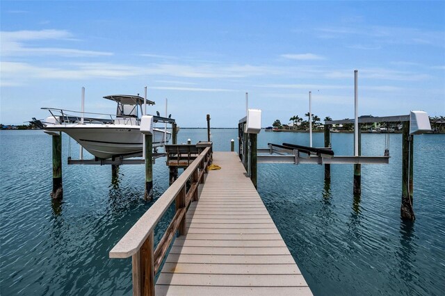 4381 Poinsettia Dr, St Pete Beach, FL 33706 - dock featuring boat lift and a water view