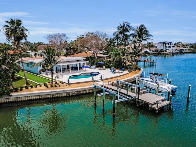 4381 Poinsettia Dr, St Pete Beach, FL 33706 - dock area featuring boat lift, a patio area, an outdoor pool, a water view, and an in-ground hot tub