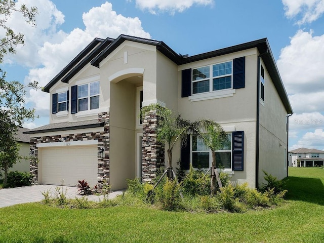 38120 Shale Stone Ct, Zephyrhills, FL 33540 - view of front facade with stucco siding, a garage, a front lawn, driveway, and stone siding