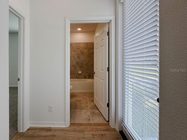 38120 Shale Stone Ct, Zephyrhills, FL 33540 - corridor with healthy amount of natural light, recessed lighting, and tile patterned flooring