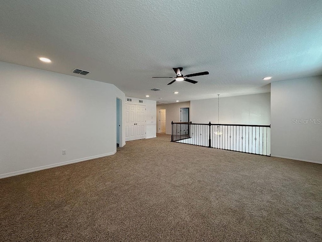 38120 Shale Stone Ct, Zephyrhills, FL 33540 - empty room featuring ceiling fan, recessed lighting, carpet, and a textured ceiling