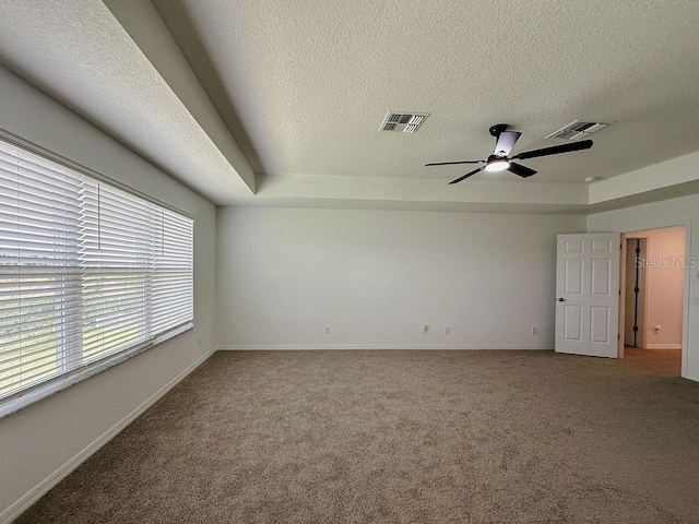 38120 Shale Stone Ct, Zephyrhills, FL 33540 - empty room with carpet, a textured ceiling, and a ceiling fan