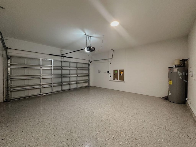 38120 Shale Stone Ct, Zephyrhills, FL 33540 - garage featuring a garage door opener, electric water heater, and electric panel