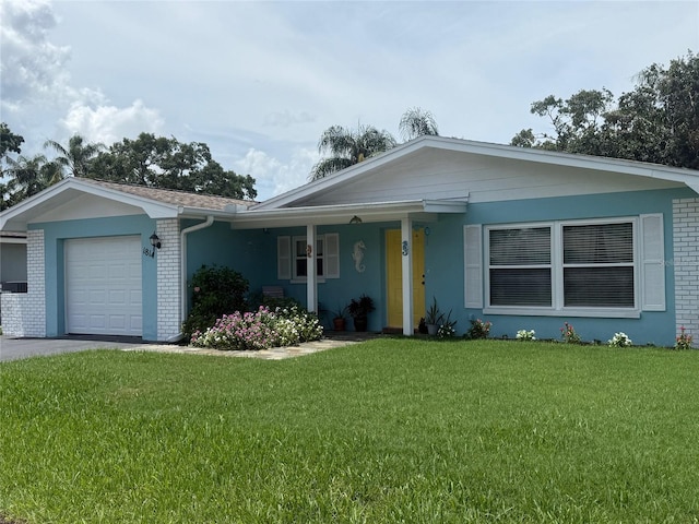 1814 Driftwood Cir S, Oldsmar, FL 34677 - ranch-style house featuring brick siding, a front yard, a garage, and stucco siding