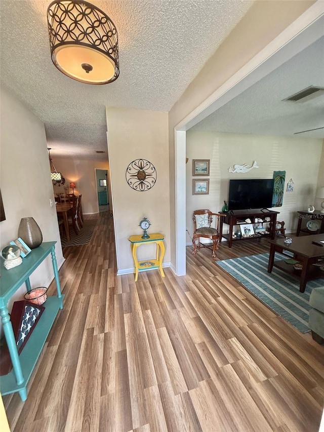 1814 Driftwood Cir S, Oldsmar, FL 34677 - hallway featuring a textured ceiling and wood finished floors
