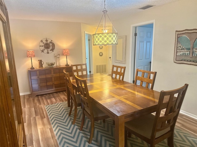 1814 Driftwood Cir S, Oldsmar, FL 34677 - dining space with wood finished floors and a textured ceiling