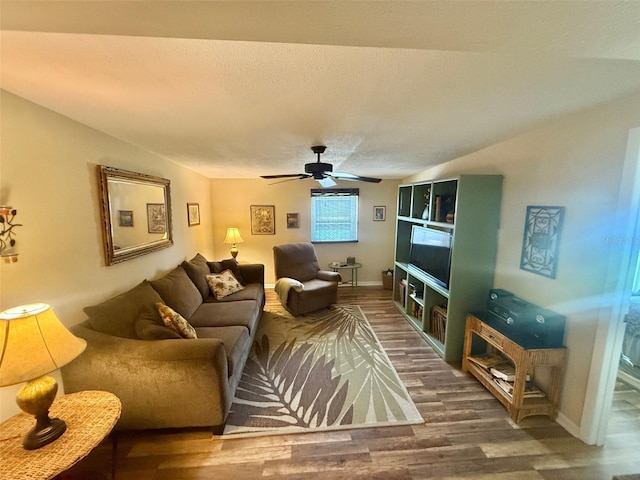 1814 Driftwood Cir S, Oldsmar, FL 34677 - living area featuring wood finished floors, ceiling fan, and a textured ceiling