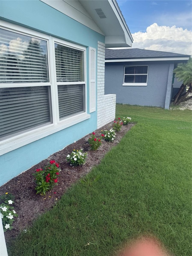 1814 Driftwood Cir S, Oldsmar, FL 34677 - view of side of property with a yard and a shingled roof