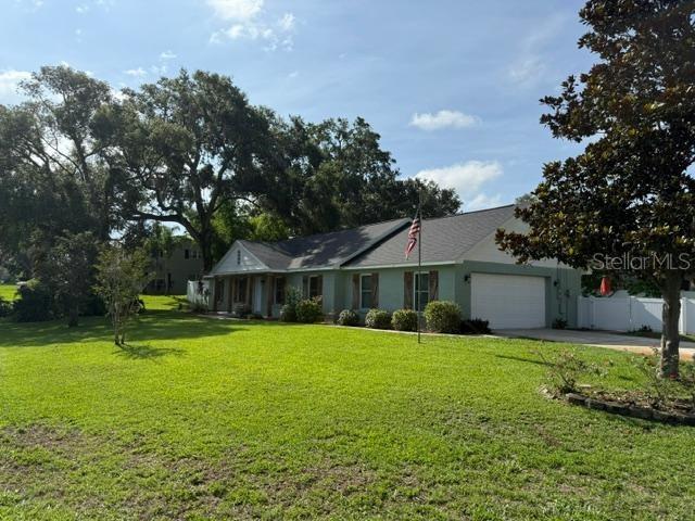 2005 Capri Rd, Valrico, FL 33594 - single story home with a garage, concrete driveway, and stucco siding