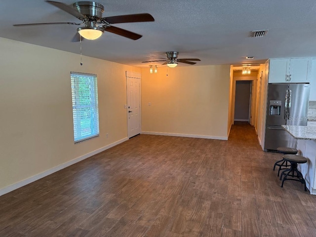 2005 Capri Rd, Valrico, FL 33594 - unfurnished living room featuring a ceiling fan and dark wood-style floors