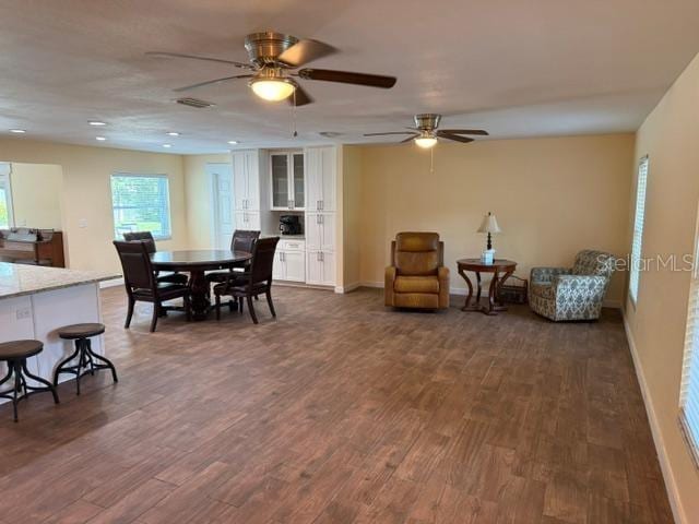 2005 Capri Rd, Valrico, FL 33594 - dining room with dark wood-type flooring, ceiling fan, and recessed lighting