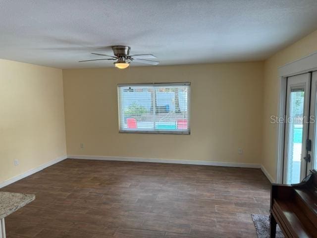 2005 Capri Rd, Valrico, FL 33594 - unfurnished room featuring a ceiling fan and dark wood finished floors
