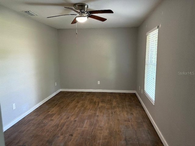 2005 Capri Rd, Valrico, FL 33594 - empty room featuring healthy amount of natural light, a ceiling fan, and dark wood-type flooring