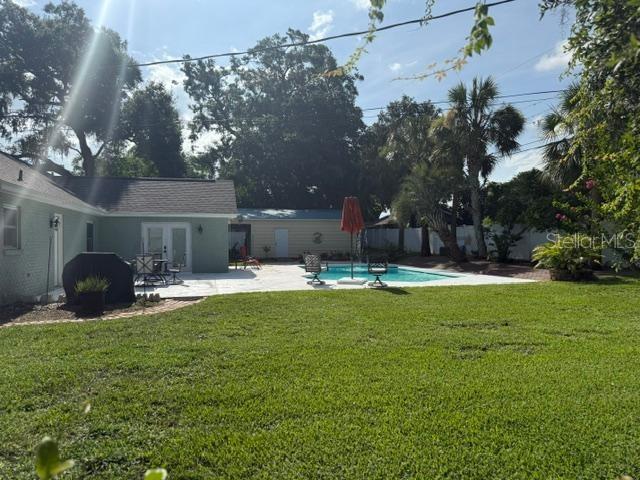 2005 Capri Rd, Valrico, FL 33594 - view of yard featuring french doors and a patio