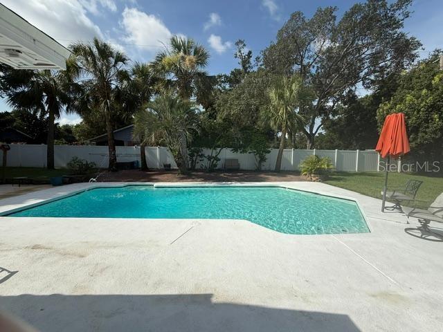 2005 Capri Rd, Valrico, FL 33594 - view of pool featuring a patio and a fenced backyard