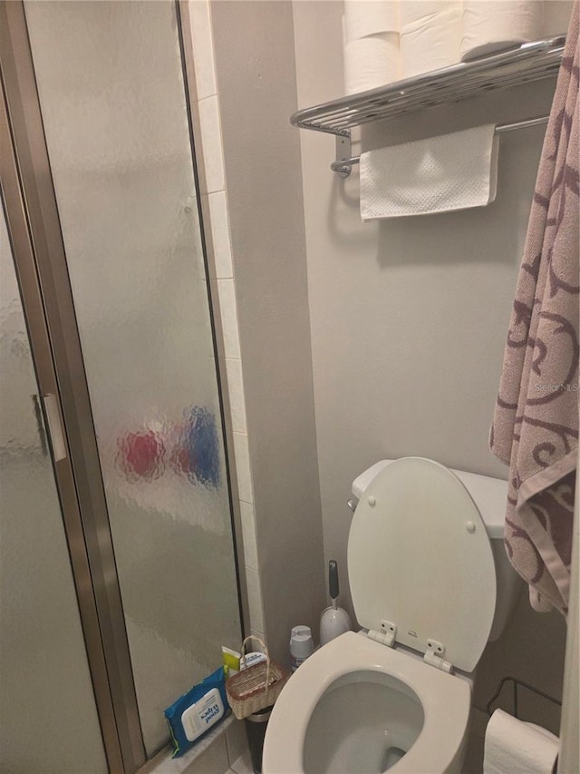 12133 Spartan Way Unit 203, Hudson, FL 34667 - bathroom featuring a shower stall and toilet