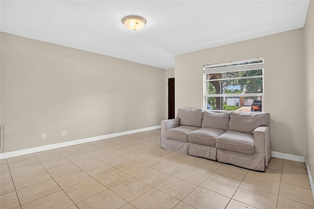 1600 Amberlea Dr N, Dunedin, FL 34698 - living area featuring light tile patterned flooring and baseboards