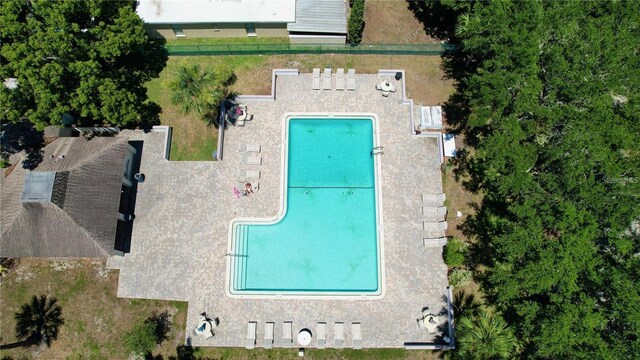 1600 Amberlea Dr N, Dunedin, FL 34698 - view from above of property featuring a pool area
