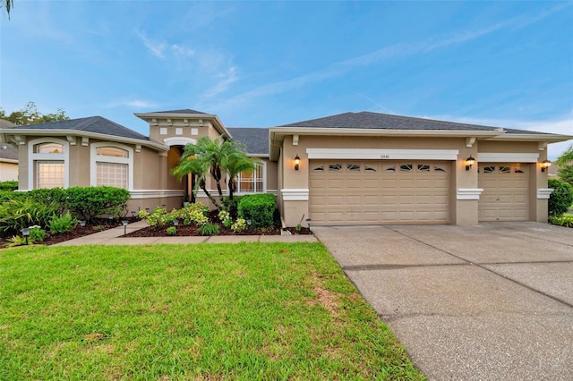 31646 Baymont Loop, Wesley Chapel, FL 33543 - view of front of property with stucco siding, an attached garage, and concrete driveway