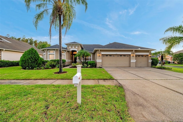 31646 Baymont Loop, Wesley Chapel, FL 33543 - view of front facade featuring an attached garage, driveway, stucco siding, and a front yard