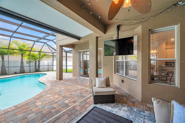 31646 Baymont Loop, Wesley Chapel, FL 33543 - view of pool with a patio area, a ceiling fan, and glass enclosure