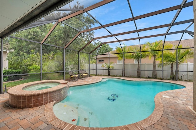 31646 Baymont Loop, Wesley Chapel, FL 33543 - view of swimming pool featuring a pool with connected hot tub, a patio, and a lanai