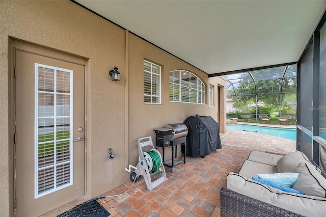 31646 Baymont Loop, Wesley Chapel, FL 33543 - view of patio with grilling area, an outdoor pool, and glass enclosure
