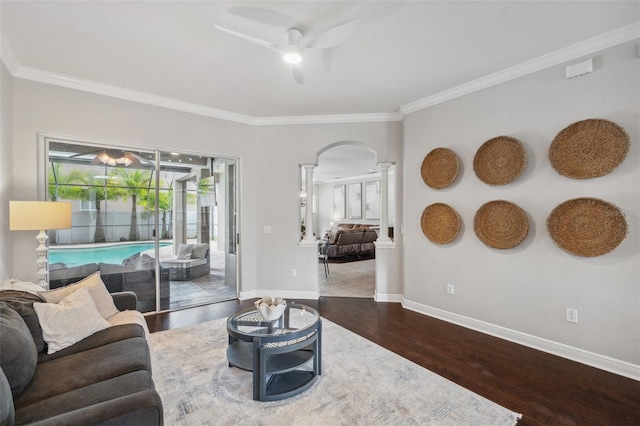 31646 Baymont Loop, Wesley Chapel, FL 33543 - living area with a ceiling fan, arched walkways, wood finished floors, and ornamental molding