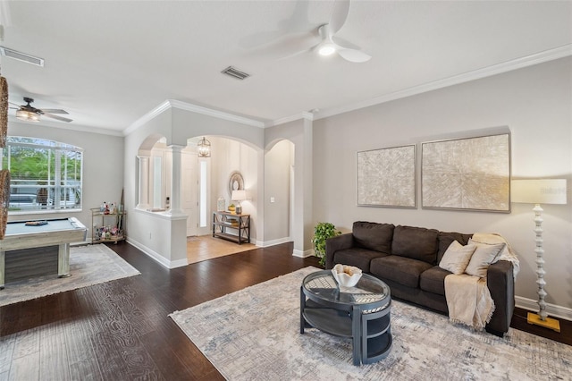 31646 Baymont Loop, Wesley Chapel, FL 33543 - living area featuring a ceiling fan, arched walkways, wood finished floors, crown molding, and decorative columns