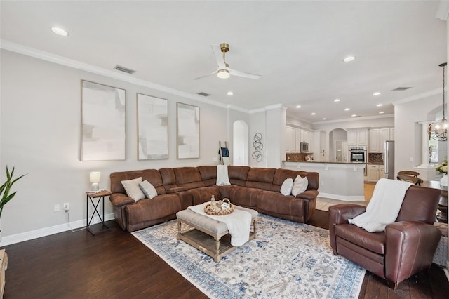 31646 Baymont Loop, Wesley Chapel, FL 33543 - living area featuring arched walkways, a ceiling fan, hardwood / wood-style flooring, recessed lighting, and crown molding