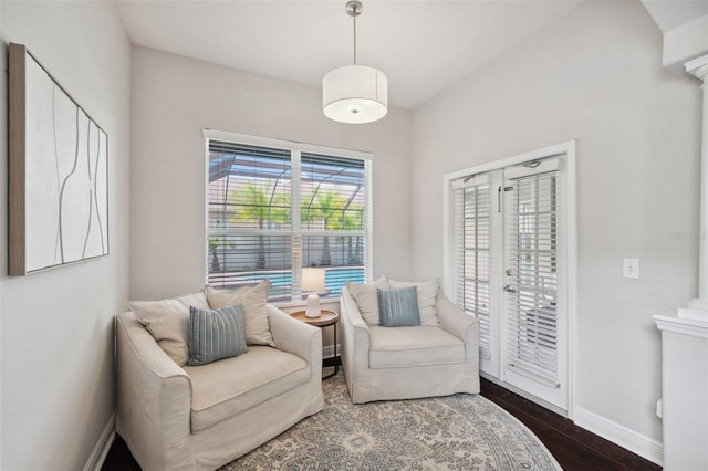 31646 Baymont Loop, Wesley Chapel, FL 33543 - living area with dark wood finished floors and ornate columns