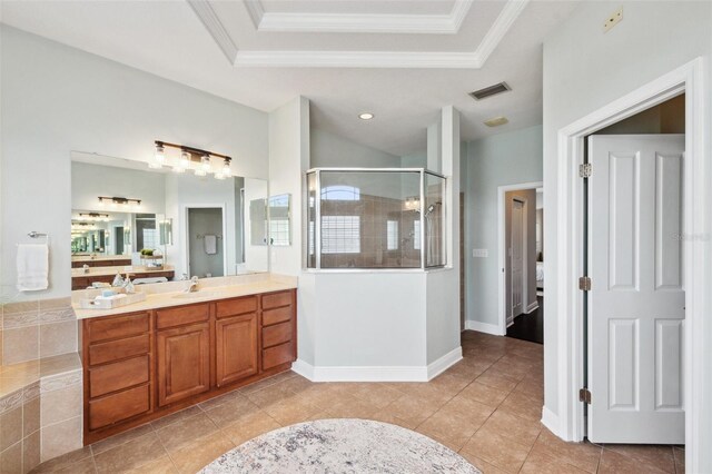 31646 Baymont Loop, Wesley Chapel, FL 33543 - full bath with vanity, a shower stall, a tray ceiling, crown molding, and tile patterned floors