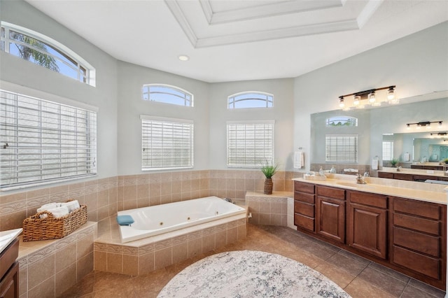 31646 Baymont Loop, Wesley Chapel, FL 33543 - full bath with vanity, a jetted tub, tile patterned floors, plenty of natural light, and crown molding