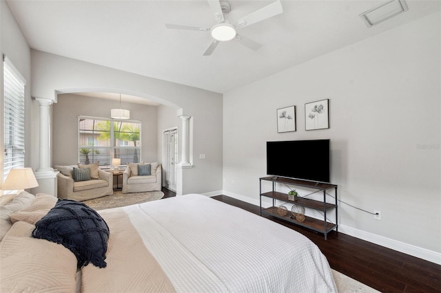 31646 Baymont Loop, Wesley Chapel, FL 33543 - bedroom with ornate columns, arched walkways, hardwood / wood-style floors, and ceiling fan