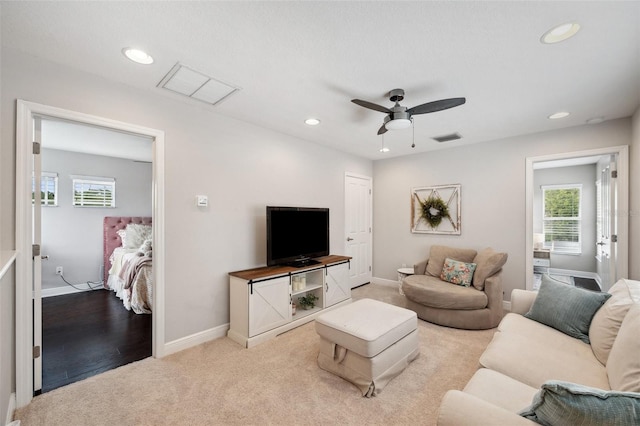 31646 Baymont Loop, Wesley Chapel, FL 33543 - living area with plenty of natural light, light colored carpet, ceiling fan, and recessed lighting